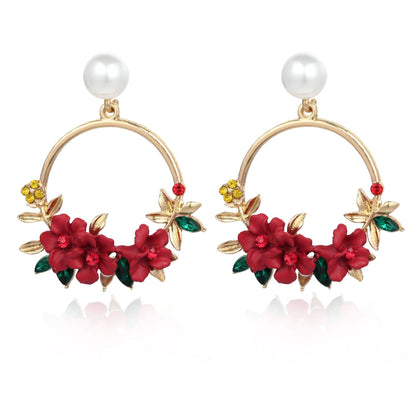 Aretes de Flores y Perlas en Oro